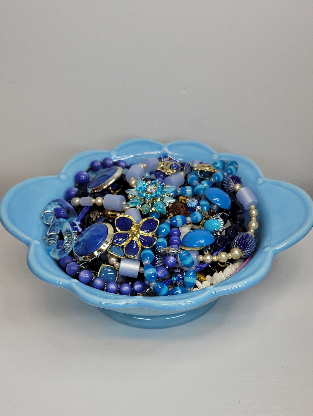 Ceramic Blue Dish Filled With Jewelry